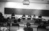 The audience listens to a panel discussion on ""The Millenial Village: A Cultural Awareness,"" 1999