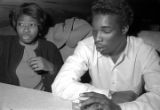 Barbara Howard Flowers and Marion Sledge, seated at a table at the Laicos Club in Montgomery, Alabama, during a New Year's celebration.