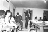 Man addressing an audience at the office of the Autauga County Improvement Association in Prattville, Alabama.