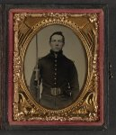 [Unidentified young soldier in Union rifleman's uniform and shoulder scales with musket and attached U.S. Model 1862 sword bayonet]