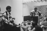 B. B. King: ""Lucifers"" in Boston, Mass. B. B. King changing clothes in dressing room, lounging on sofa, performing on stage (BKP 4-76-5)