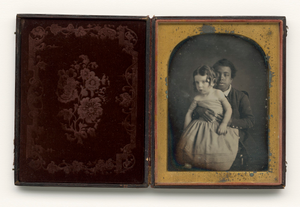 Thumbnail for Daguerreotype of a boy holding a white baby