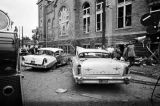 Damaged cars in the street after the bombing of 16th Street Baptist Church in Birmingham, Alabama.