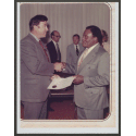 Andrew Best receives his UNC Board of Governors certificate of membership