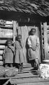 Three African American children in front of a cabin in Wilcox County, Alabama.