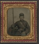 [Unidentified young soldier in Union uniform with musket and bayonet in scabbard]