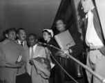 Autherine Lucy, Thurgood Marshall, and Arthur Shores after a hearing at the federal courthouse in Birmingham, Alabama.