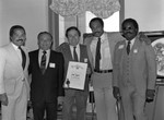 Jack Rodri and Ken Norton receiving a commendation at City Hall, Los Angeles, 1983