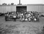 Capital Veneer Works employees with their families outside the plant in Montgomery, Alabama.