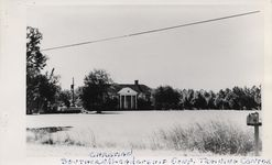 Mississippi State Sovereignty Commission photograph of a Greek revival style brick house with four white columns used as a training facility for Southern Christian Leadership Conference, McIntosh, Georgia, 1960s