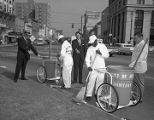 Sanitation crew sweeping up trash in Court Square at Commerce Street in Montgomery, Alabama.