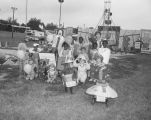 Ronald McDonald with children in costumes at the 1985 South Alabama Fair in Montgomery, Alabama.