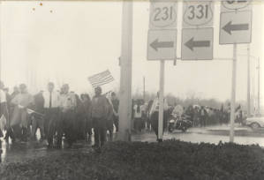 Marchers walking in the rain in Montgomery during the Selma to Montgomery March.