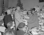 African American woman receiving a basket of food from the Salvation Army at the Citadel at 308 North Lawrence Street in Montgomery, Alabama, on Christmas Eve.