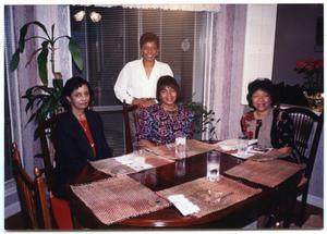 Four Smiling Women in Dining Space