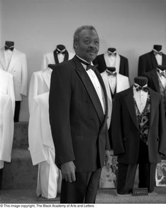 Photograph of John Dudley Ingram posing with tuxedos #2