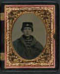 [Unidentified young soldier in Union musician's uniform and coat]