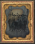 [Sergeant Joseph Kennedy Marshall of Co. D, 20th Tennessee Infantry Regiment, with unidentified prisoners in uniform at Rock Island Prison, Illinois]