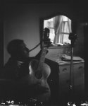 [Blind Willie McTell with 12-string guitar, hotel room, Atlanta, Georgia]