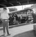 Freedom riders waiting outside a bus at the Greyhound station in Birmingham, Alabama, attempting to board for the trip to Montgomery.