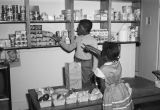 Children pretending to grocery shop at the Children's Hope Center at 487 South Jackson Street in Montgomery, Alabama.
