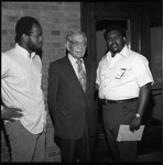 Claude H. Hudson posing with two unidentified African American men, Los Angeles, 1972