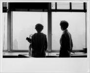 Thelma and Elizabeth look out the window, New York, NY, 1958