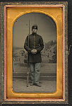 [Unidentified soldier in Union uniform with bayoneted musket in front of painted backdrop showing formal garden and lake]