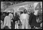 Some of the Negroes watching itinerant salesman selling goods from his truck in the center of town on Saturday afternoon, Belzoni, Mississippi Delta, Mississippi