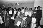 California African American Museum guests holding commendations, Los Angeles, 1983