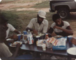 Members of the American Agriculture Movement eating barbecue at a gathering on Oscar Belvin’s farm in Montezuma, Georgia.