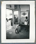 Young boy at gumball machine