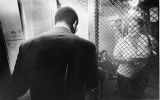 "A guard enters the area of Philadelphia's Frankford High School occupied by protesting parents."