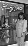 Baby Doll's Hair Design owner posing by the shop window, Los Angeles, 1989