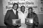 Todd Davis and Bianca Ferguson holding awards at the Pied Piper nightclub, Los Angeles, 1983