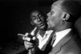 Man singing with a band at Tom's Place at 648 South Holt Street in Montgomery, Alabama.