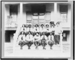 [Student basketball players of the National Training School for Women and Girls, Washington, D.C., seated on steps for team(?) photo]