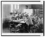 [Students examining corn in classroom at the Tuskegee Normal and Industrial Institute]