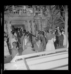 Black Boston University students leave BU Administration Building as their 12-hour sit-in at the building ends