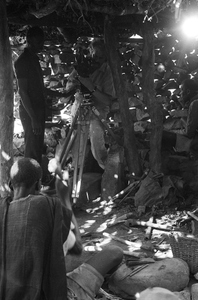 Cameraman Georges Bracher filming Dolo, the blacksmith. Ogol du Haut village, Mali