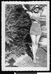 Marguerite Edwards in a bathing suit in her backyard, August 1951, Los Angeles