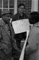 Scott B. Smith of SNCC speaking with Mike Bibler and John Davis of SCLC, in front of the Barbour County courthouse in Eufaula, Alabama.