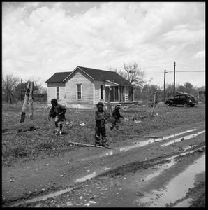 Children by a Muddy Dirt Road