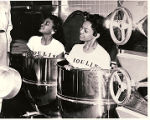 Photograph of showgirls posing in the kitchen for Moulin Rouge publicity, [May 6], 1955.