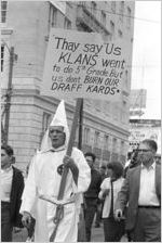 Klansman and other marchers in a parade during a Ku Klux Klan rally in Montgomery, Alabama.