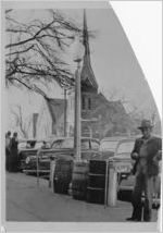 Segregated water fountains with First Presbyterian Church down the street in the background, Athens, Alabama