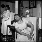 [Store Front Churches. Woman seated with head back]