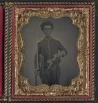 [Unidentified soldier in Union cavalry uniform with Savage revolver and sword]