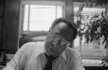 Alex Haley: Seated at desk (AHP 1-79-11 #63)