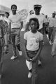 Young girl participating in the 20th anniversary reenactment of the Selma to Montgomery March, probably in rural Dallas or Lowndes County, Alabama.